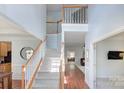 Bright and airy foyer with a staircase and hardwood floors at 3632 Cole Mill Rd, Charlotte, NC 28270