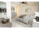 Bright bedroom with modern furnishings, neutral decor, and a ceiling fan at 383 Camden Nw Ct, Concord, NC 28027