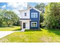 Stylish two-story home with a unique exterior design and a well-kept lawn at 413 Jose St, Shelby, NC 28150
