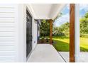 Inviting covered front porch with wood columns and a view of the landscaped front yard at 413 Jose St, Shelby, NC 28150