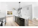 Modern kitchen island features a sleek faucet and stainless-steel dishwasher at 413 Jose St, Shelby, NC 28150