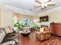 Bright living room with a fireplace and large windows that offer natural light at 517 N Graham St # 3E, Charlotte, NC 28202