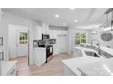 Modern kitchen with white cabinets, stainless steel appliances, and sleek countertops at 5564 N Hillsdale Dr, Fort Lawn, SC 29714