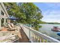 Expansive wooden deck overlooking the lake, perfect for outdoor enjoyment at 592 Shoreline Rd, New London, NC 28127