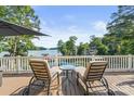 Relaxing deck with lounge chairs offering scenic waterfront views at 592 Shoreline Rd, New London, NC 28127