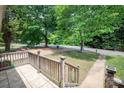 Inviting front porch with tiled flooring and a view of the well-maintained front yard at 734 Club Dr, Statesville, NC 28677