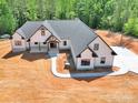 Expansive aerial view of a modern home with gray roof, white siding, and large driveway at 124 Starboard Ln, Statesville, NC 28677