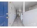 Inviting entryway with neutral tile flooring leading to the living spaces at 12749 Mosby Ln, Charlotte, NC 28273