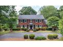 Charming two-story brick home with manicured landscaping and a circular driveway at 1285 10Th Street Nw Blvd, Hickory, NC 28601