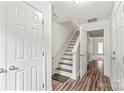 Bright entryway with hardwood floors, white trim, and a staircase to the upper level at 1707 Kashmir White Ln, Fort Mill, SC 29708