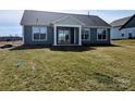 A well-maintained backyard features green lawn, complementing the home's exterior at 1933 Hendricks St, Rock Hill, SC 29732