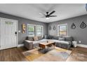 Stylish living room with a comfortable sectional sofa, modern decor, and ample natural light at 2212 Acme Rd, Belmont, NC 28012