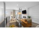 Cozy living room showcasing modern decor, hardwood floors, a fireplace, neutral colors, and stylish furnishings at 2863 Grand Union Way, Charlotte, NC 28209