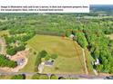 Aerial view of the property with a outlined lot line and lush surrounding landscape at 3610 Providence Mill Rd, Maiden, NC 28650