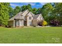 Beautiful two-story home with a well-manicured lawn and colorful landscaping at 3610 Providence Mill Rd, Maiden, NC 28650