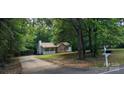 View of home with a front yard, carport, and well-maintained landscaping providing a serene setting at 4409 Homestead Rd, Rock Hill, SC 29732