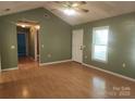 Another shot of the living room featuring lots of natural light, hardwood floors and a modern ceiling fan at 4409 Homestead Rd, Rock Hill, SC 29732