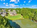 A beautiful backyard and pond are featured in this aerial view of the home at 458 Inverness Pl, Rock Hill, SC 29730
