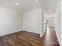 Bright, open living room with new hardwood floors and neutral paint provides a blank canvas at 4623 Harris Elliot Rd, Lincolnton, NC 28092