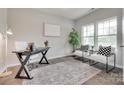 Stylish home office with natural light, modern desk, comfortable chairs, and tasteful decor at 5305 Friendly Baptist Church Rd, Indian Trail, NC 28079
