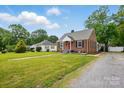Charming brick home with a well-maintained lawn and a convenient driveway at 604 Meadowbrook Rd, Kings Mountain, NC 28086
