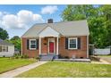 Charming brick home with a red front door and green lawn at 604 Meadowbrook Rd, Kings Mountain, NC 28086