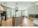 Bright kitchen with large windows, hardwood floors, and stainless appliances at 738 Garden District Dr, Charlotte, NC 28202