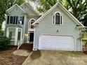 Charming two-story house features a convenient two-car garage and welcoming front entrance at 9907 Furlong Trl, Charlotte, NC 28269