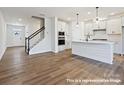 Open floor plan with new kitchen featuring quartz countertops, island, and modern appliances at 11455 Prosperity Church Rd, Huntersville, NC 28078