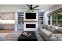 Inviting living room featuring a modern fireplace and stylish built-in shelving at 1423 N New Hope Rd, Gastonia, NC 28054