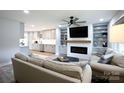Spacious living room featuring a cozy sofa and an entertainment center at 1423 N New Hope Rd, Gastonia, NC 28054