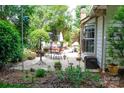 Outdoor patio with ample seating and lush greenery, perfect for entertaining and relaxation at 14406 Gadwall Ct, Charlotte, NC 28273