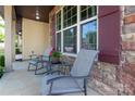 Comfortable front porch seating with brick accents, offering a relaxing spot to enjoy the outdoors at 159 Saye Pl, Mooresville, NC 28115