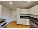 Kitchen with granite countertops, white cabinets, and stainless steel appliances at 2001 Tyvola Rd, Charlotte, NC 28210