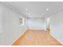 Open living area with hardwood floors, neutral paint, and recessed lighting for a modern touch at 2001 Tyvola Rd, Charlotte, NC 28210