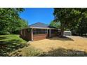 Charming brick home with black framed windows and a well-maintained lawn at 2203 Arney St, Lincolnton, NC 28092