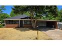 Charming brick home with black framed windows and carport at 2203 Arney St, Lincolnton, NC 28092
