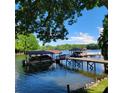 Enjoy serene lake views from your private dock with boat slip, ideal for boating and relaxation at 221 Stillwater Rd, Troutman, NC 28166