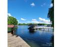 This property has a private dock with boat slip, offering peaceful lake views and water activities at 221 Stillwater Rd, Troutman, NC 28166