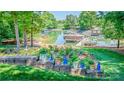Lakefront backyard featuring a lush garden, multiple boat docks and storage, and scenic water views at 2580 Penngate Dr, Sherrills Ford, NC 28673