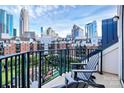 Relaxing balcony featuring comfortable seating and a stunning city skyline view, perfect for enjoying the outdoors at 300 W 5Th St # 644, Charlotte, NC 28202