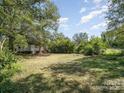 Spacious backyard with lush greenery, perfect for outdoor activities and enjoying nature at 324 State St, Rock Hill, SC 29730