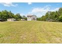 Spacious front yard with a two-story home, detached garage, and ample parking at 3401 Shillinglaw Rd, Sharon, SC 29742