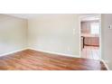 Bright dining area featuring wood floors leading into the kitchen at 3455 Hickory Pl, Salisbury, NC 28144