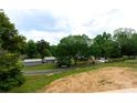 Beautiful community with mature trees and well-maintained homes, perfect for peaceful living at 462 Berry Hill Dr, Norwood, NC 28128