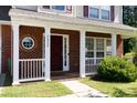 Inviting front porch with white columns and charming details at 4642 Laurendale Ct, Rock Hill, SC 29732