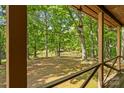 Scenic backyard view with lush trees and a wooden fence creating a private and serene outdoor space at 536 Brookhaven Rd, Statesville, NC 28625
