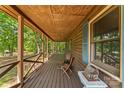 Spacious front porch with seating area, wooden floors, railings, and a charming outdoor decorative piece at 536 Brookhaven Rd, Statesville, NC 28625