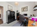 Office with a large Cabela's safe, desk, gray rug, decor, and neutral-toned walls at 5727 Lavaux Ct, Charlotte, NC 28214