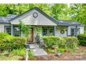 Quaint home exterior featuring a covered porch, manicured shrubs, and a walkway at 622 Neelys Creek Rd, Rock Hill, SC 29732